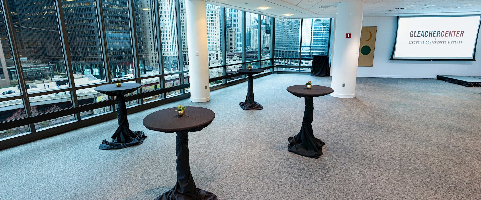 Gleacher Center conference area and cocktail tables overlooking the Chicago River