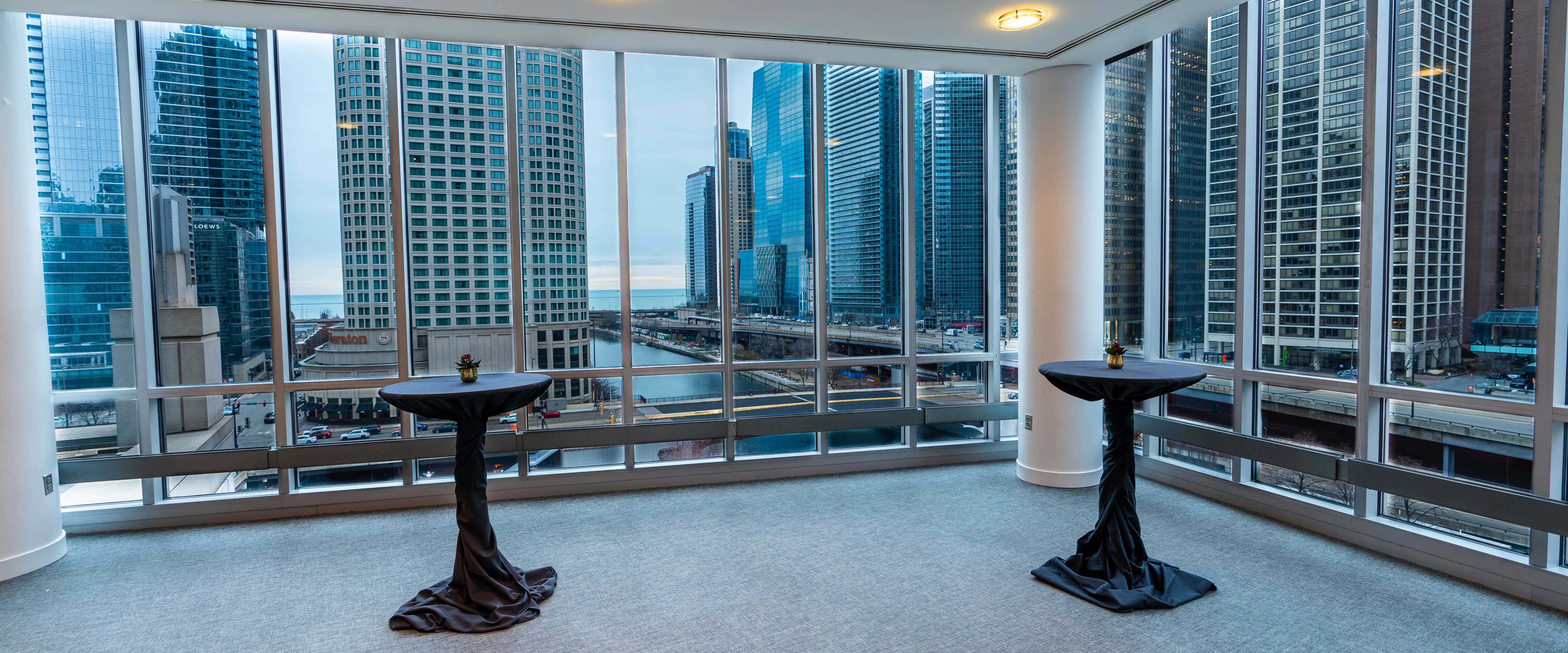 Cocktail tables at the Gleacher Center overlooking the Chicago River