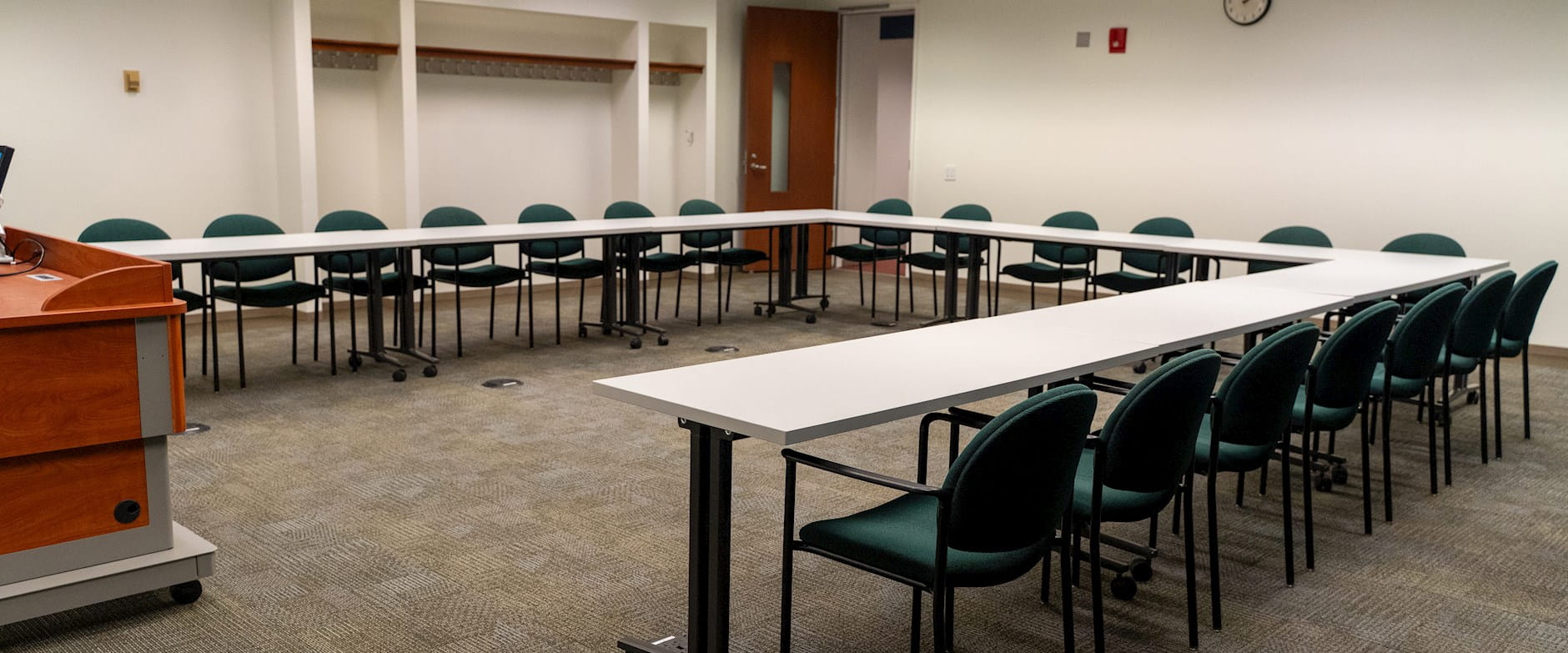 Executive Meeting Room view with u-shaped table arrangement.